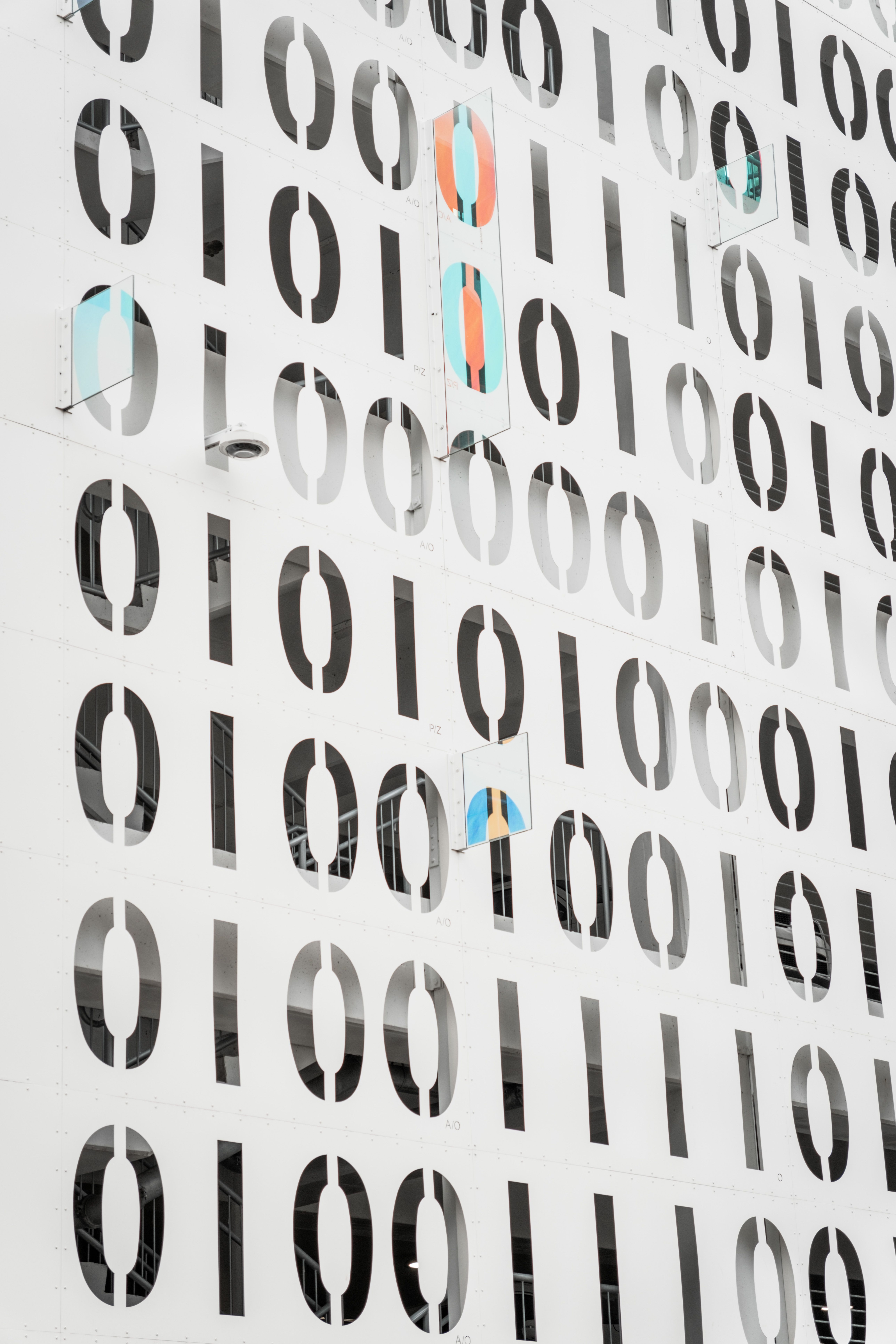 Modern architecture facade with binary pattern design adds a digital touch to urban landscapes.