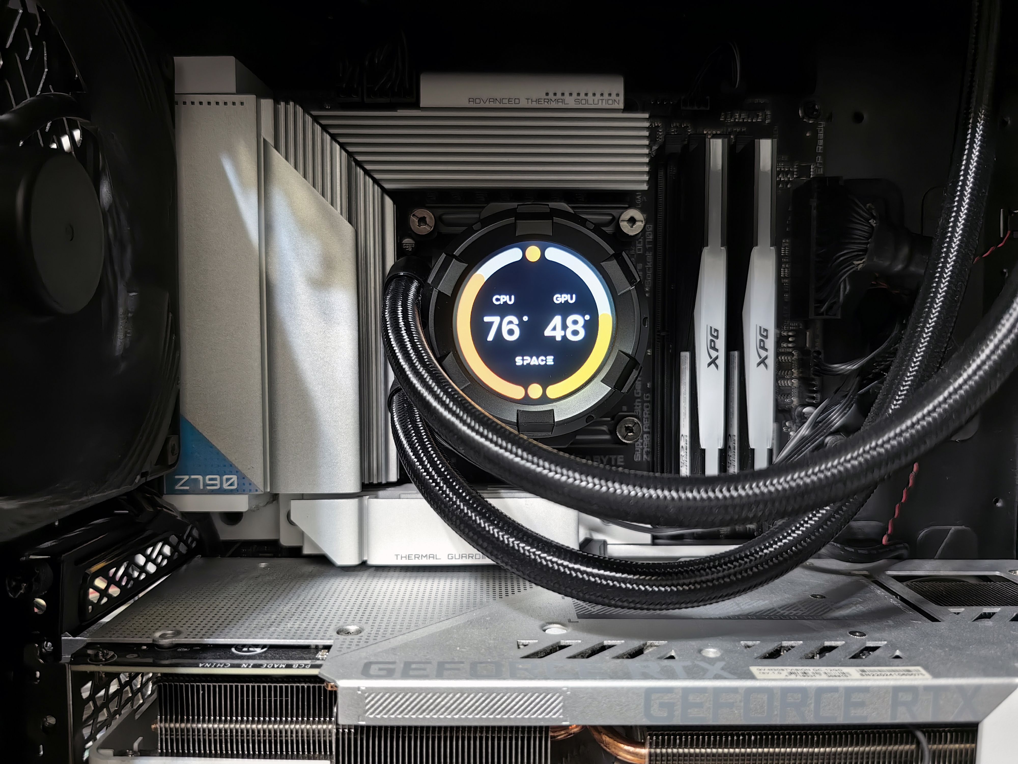 Close-up view of advanced PC hardware with visible GPU and cooling system in detail.