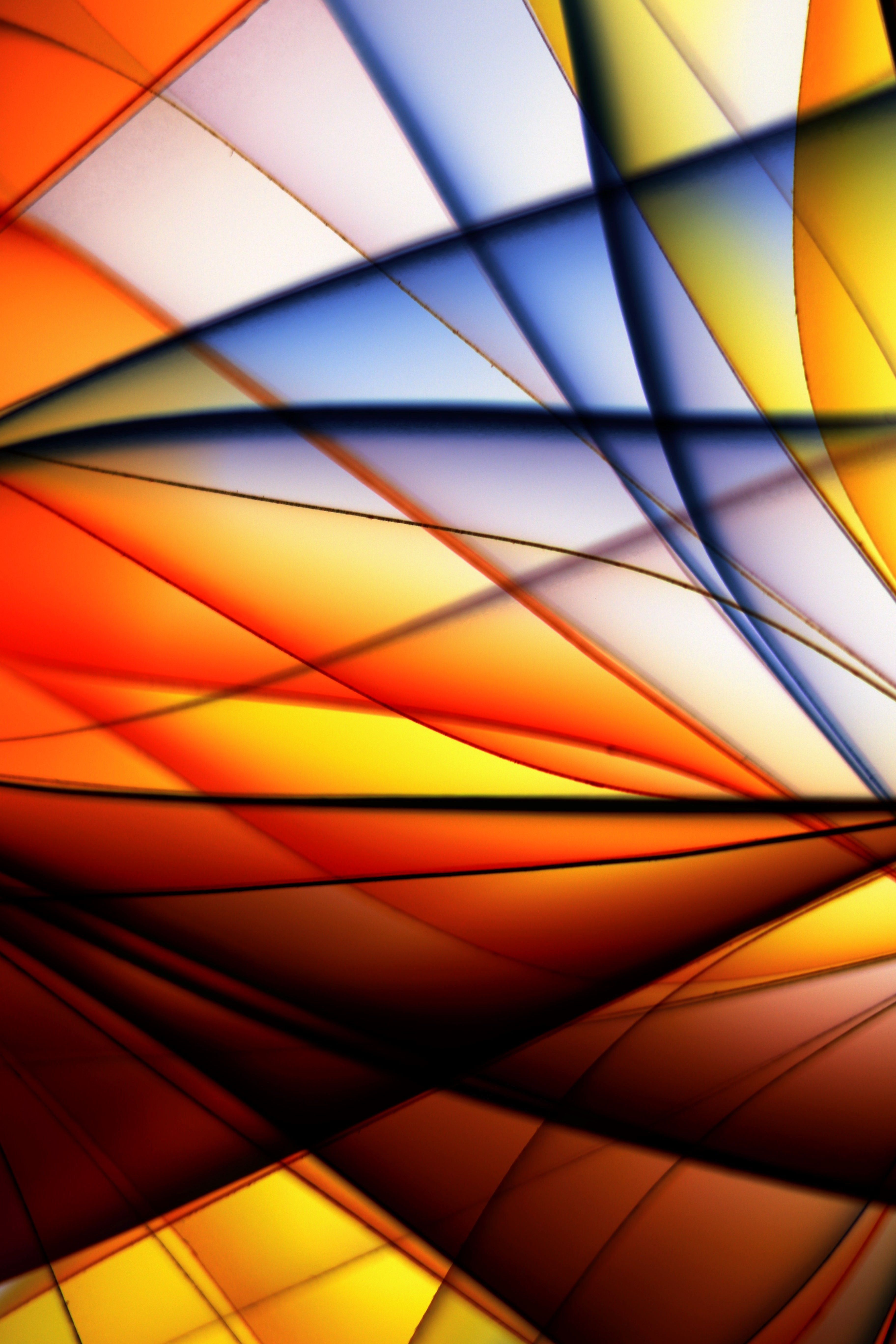 Abstract image featuring bold and vibrant overlapping colors creating a dynamic pattern.