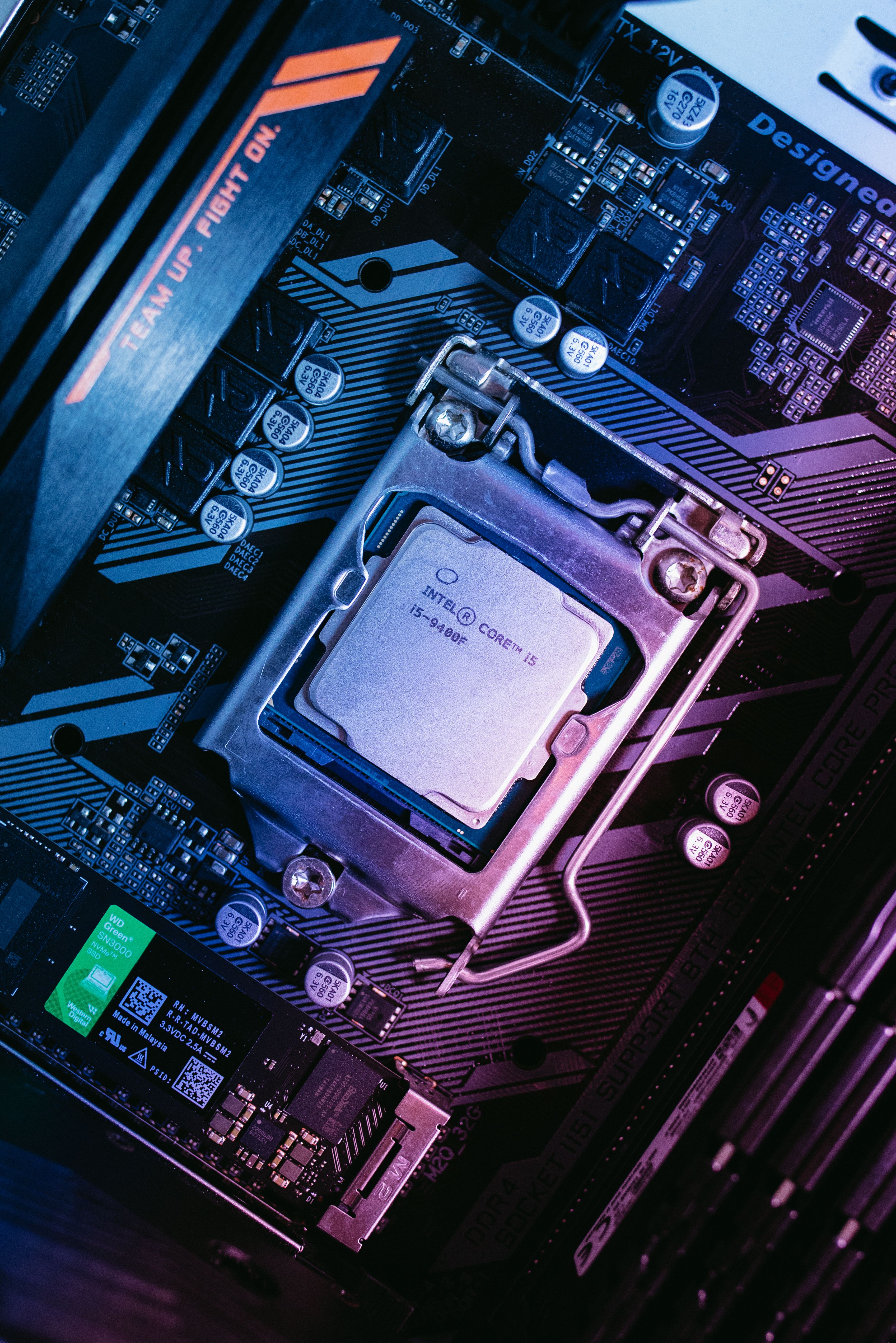 Detailed view of a computer motherboard with installed CPU, showcasing high-tech components.