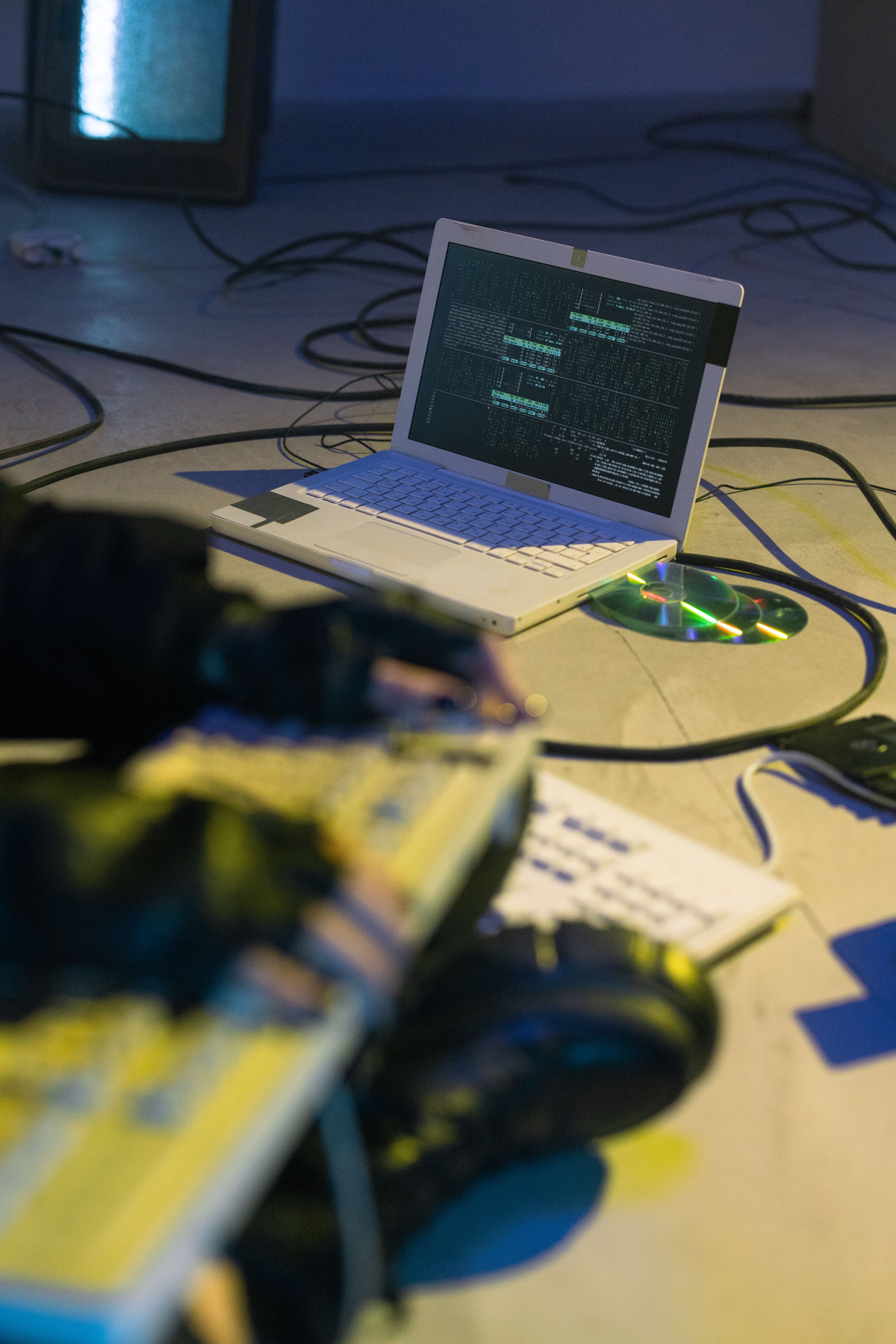 Laptop with coding software on-screen, symbolizing cybersecurity and tech innovation.