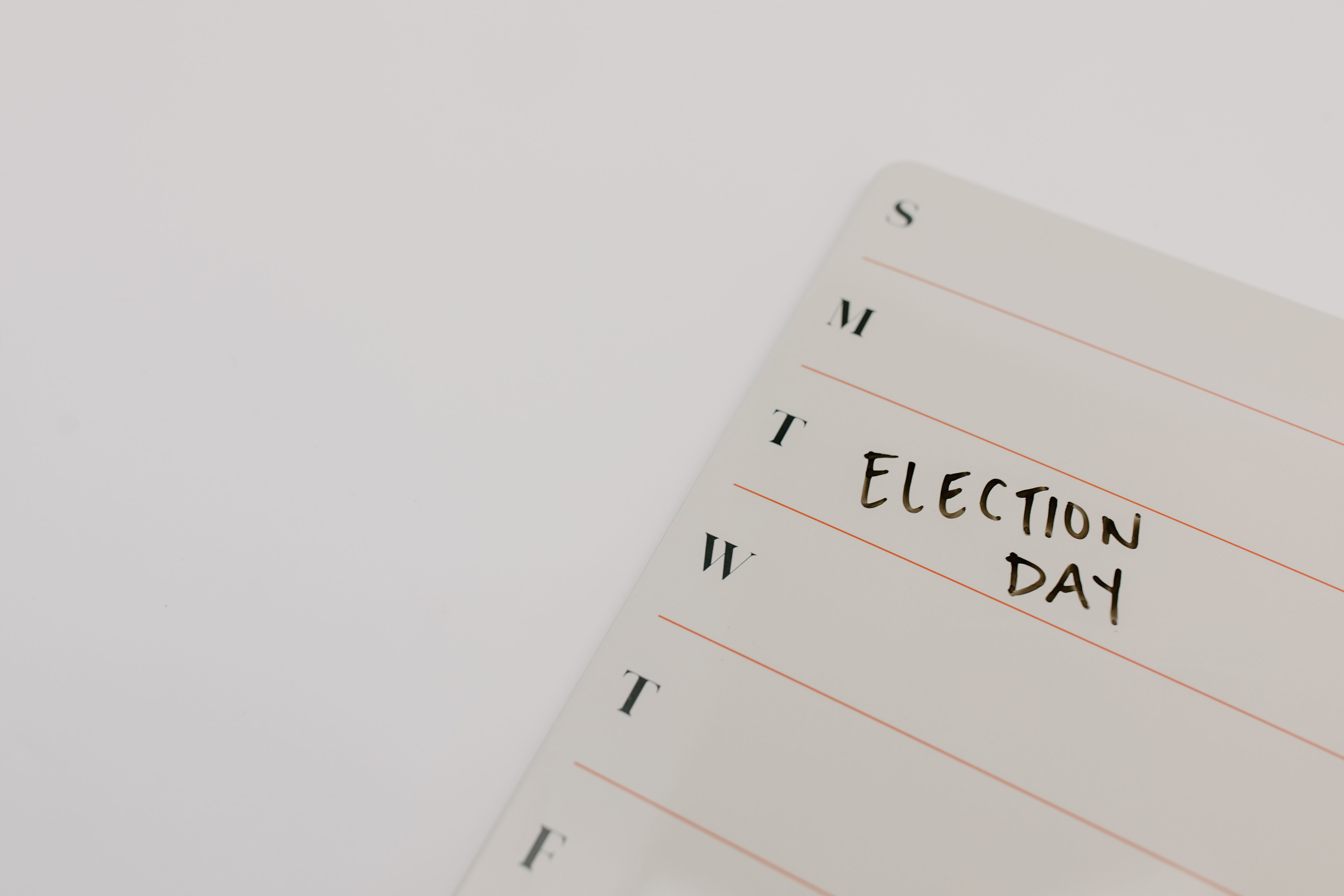 Close-up of a planner page marked with 'Election Day' reminding viewers of the important date.