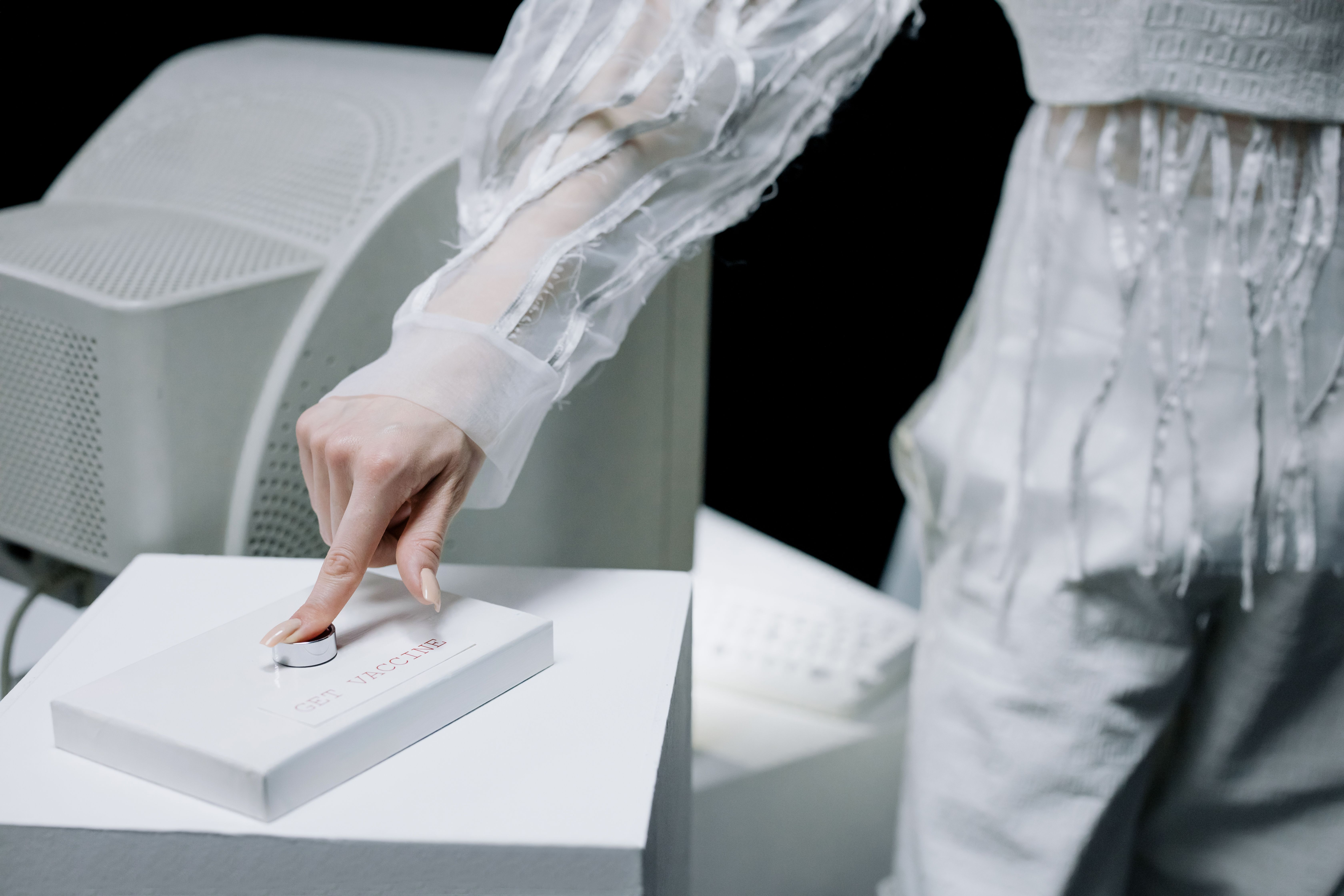 Woman in sleek attire operates cutting-edge laboratory equipment in a tech-focused environment.